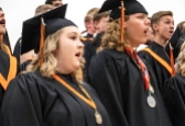 Molly Penas, Riley Mitchell and the Concert Choir perform one last song together at Fort Calhoun graduation.