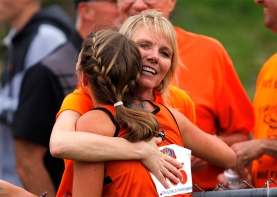 Fort Calhoun’s Taya Skelton gets a hug from her mother, Cindy, at Omaha Burke Stadium