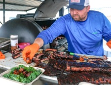 Jessie Dorau prepares a box of smoked burnt ends as his competition side dish.